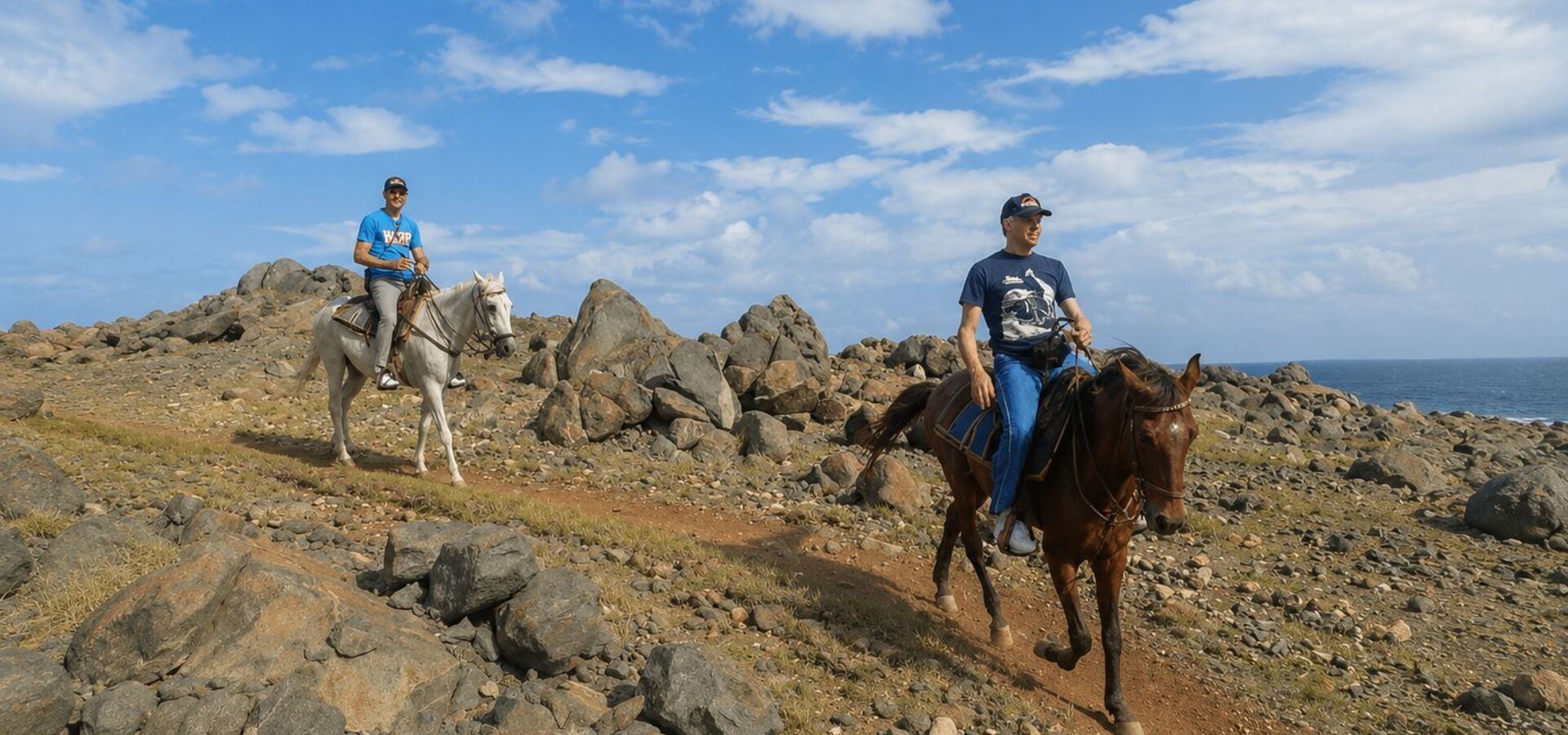 2 horseback riders at the north area of Aruba